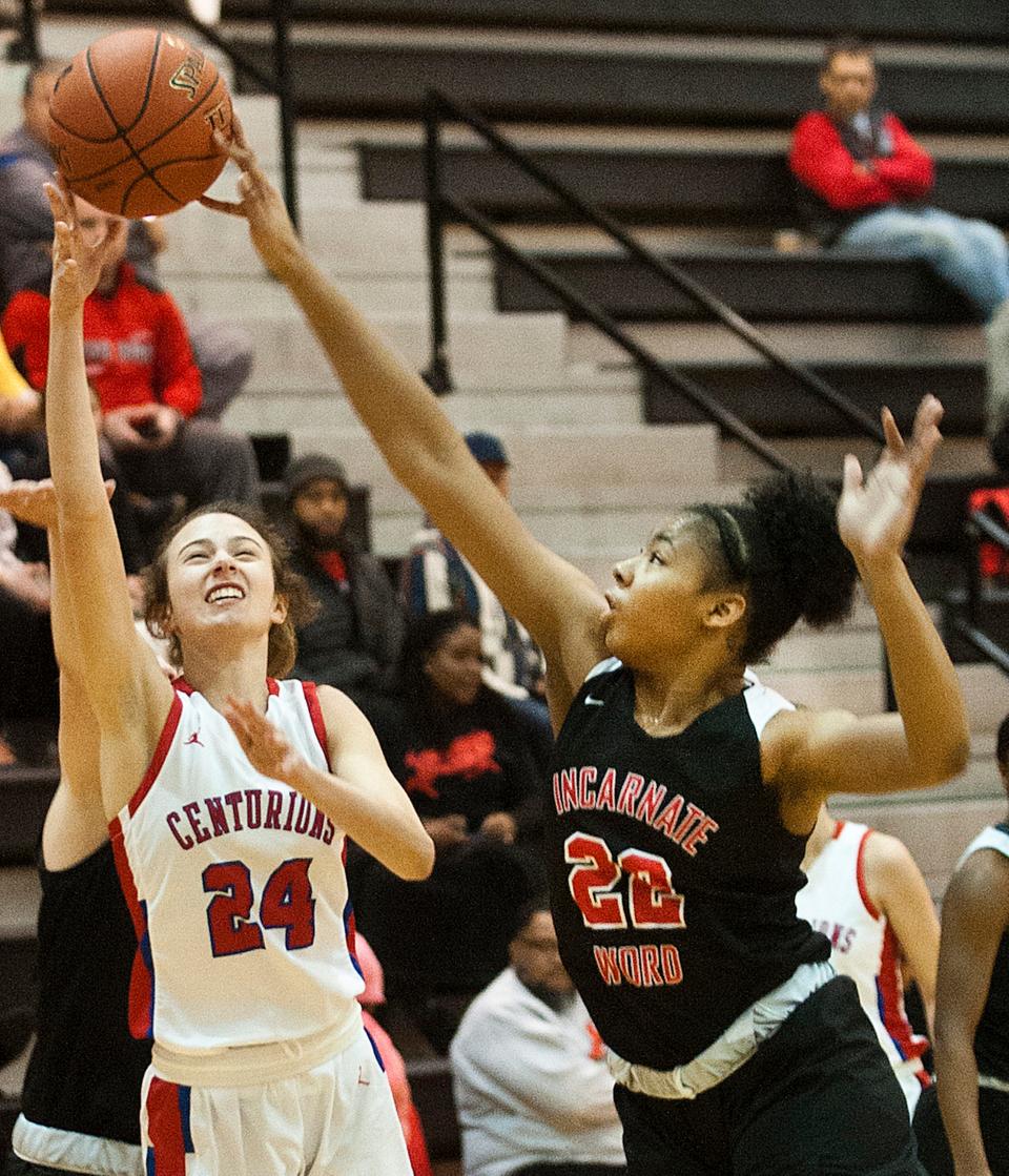 Incarnate Word (St. Louis) guard Jaiden Bryant tips the ball away as CAL guard Abigail Embry put up a shot.25 January 2020