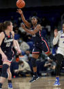 Connecticut guard Christyn Williams (13) makes a pass against DePaul in the first half of an NCAA college basketball game at Wintrust Arena in Chicago on Wednesday, Jan. 26, 2022. (Chris Sweda/Chicago Tribune via AP)