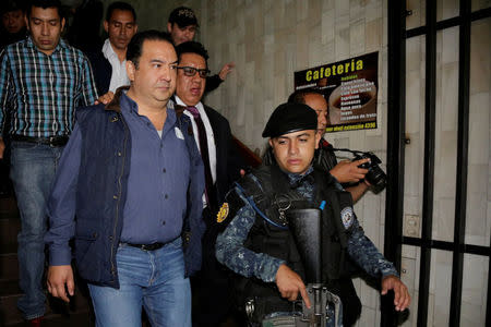 Sammy Morales, (L) brother of Guatemala's president Jimmy Morales, arrives at the court after being arrested for his alleged involvement in a corruption case in Guatemala City, Guatemala, January 18, 2017. REUTERS/Luis Echeverria