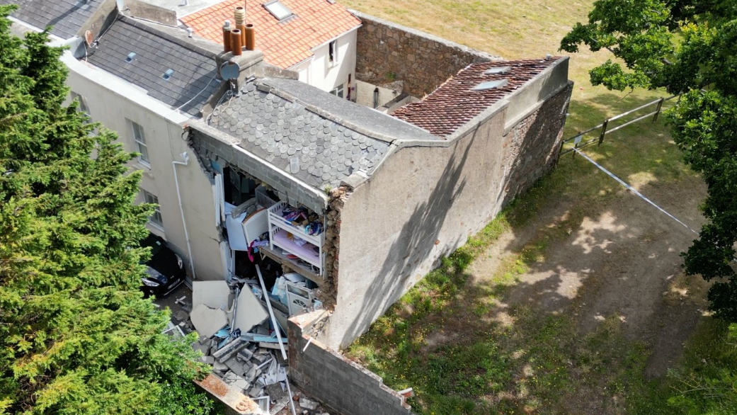 Aerial view of a house damaged in an incident in Jersey