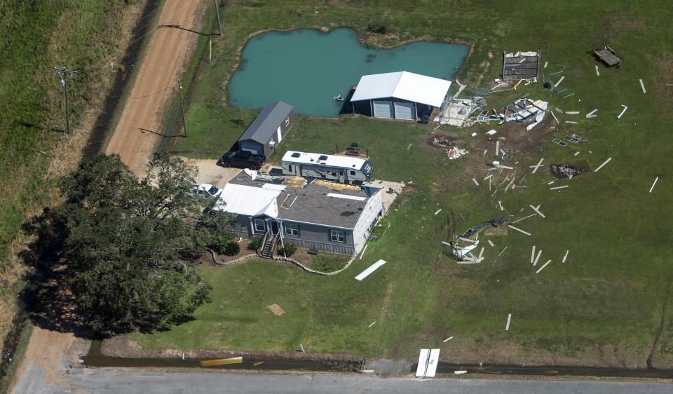 A debris field, fallen tree and structure damage are seen in the aftermath of Hurricane Delta Saturday Oct. 10, 2020, in Gueydan, La. (Bill Feig/The Advocate via AP, Pool)