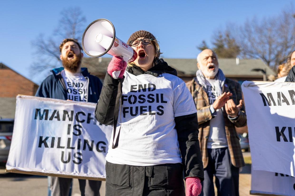 <span>Members of Climate Defiance protest against Joe Manchin outside an event in Manchester, New Hampshire, on 12 January 2024.</span><span>Photograph: Scott Eisen/Getty Images</span>