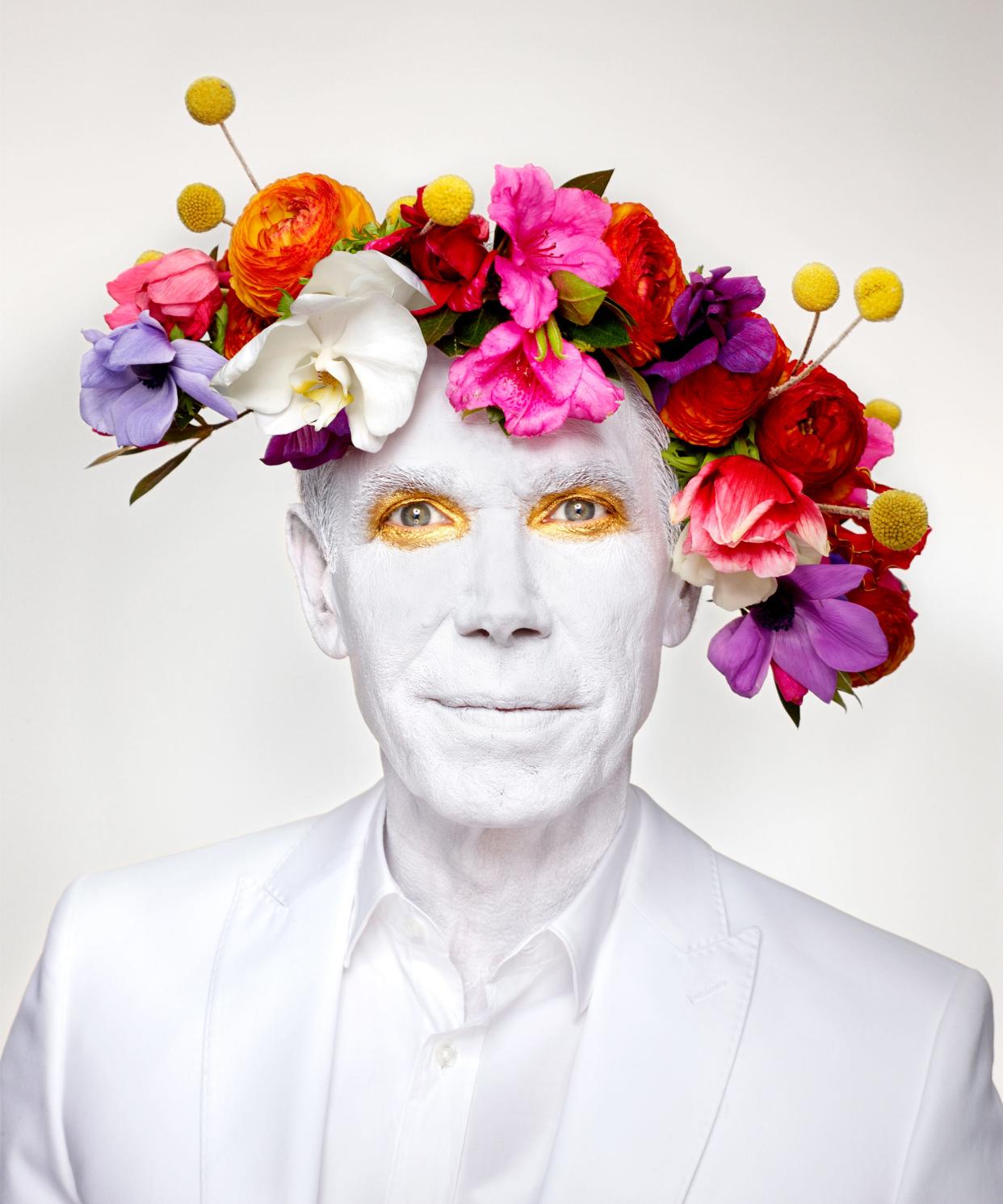 A photo by Martin Schoeller of the artist Jeff Koons wearing a floral headpiece is one of the images featured in the exhibition “Flora Imaginaria: The Flower in Contemporary Photography” at Selby Gardens.