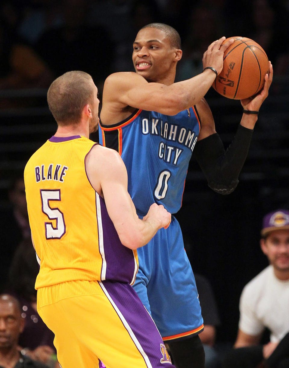 LOS ANGELES, CA - MAY 19: Russell Westbrook #0 of the Oklahoma City Thunder looks to move the ball against Steve Blake #5 of the Los Angeles Lakers in the second quarter in Game Four of the Western Conference Semifinals in the 2012 NBA Playoffs on May 19 at Staples Center in Los Angeles, California. NOTE TO USER: User expressly acknowledges and agrees that, by downloading and or using this photograph, User is consenting to the terms and conditions of the Getty Images License Agreement. (Photo by Stephen Dunn/Getty Images)