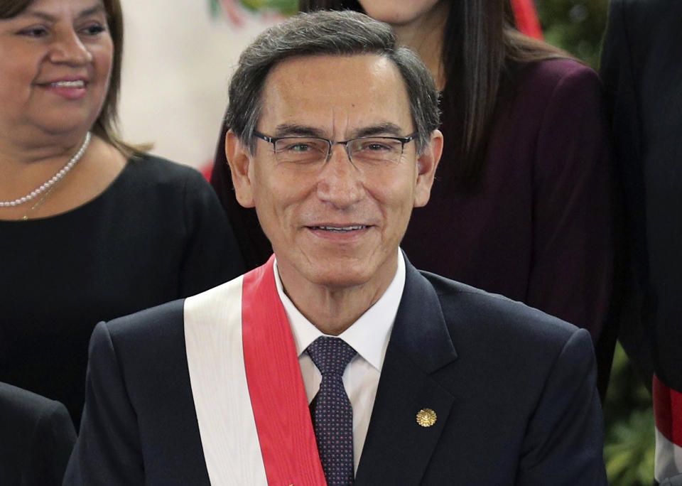 FILE - In this Oct. 3, 2019 file photo, Peru's President Martin Vizcarra smiles after the swearing-in ceremony of his new cabinet at the government palace in Lima, Peru. On July 28, 2020, the anniversary of independence, Vizcarra tried in a televised speech to galvanize a country battered, like so many others around the world, by economic calamity and mass death from the new coronavirus. (AP Photo/Martin Mejia, File)