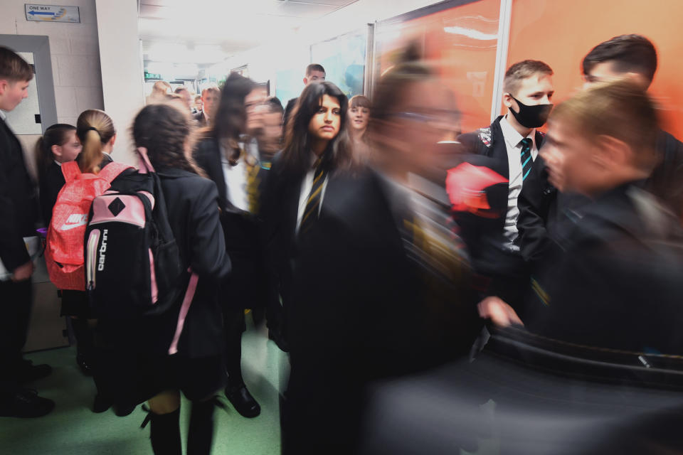 <p>STALYBRIDGE, ENGLAND - SEPTEMBER 09: Pupils walk between classrooms as they return to school at Copley Academy on September 09, 2021 in Stalybridge, England. Senior school pupils, returning to school across the UK during the second year of the worldwide Coronavirus pandemic, are taking part in a mass program of lateral flow tests designed to minimise the risk of spreading Covid-19. (Photo by Anthony Devlin/Getty Images)</p>
