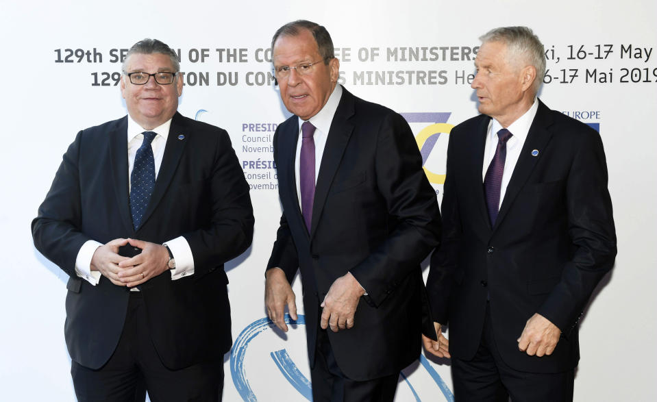 Finland's Minister of Foreign Affairs Timo Soini, left, Russia's Minister of Foreign Affairs Sergei Lavrov and Secretary General of the Council of Europe Thorbjorn Jagland pose for the media at the ministers for foreign affairs of the Council of Europe's annual meeting in Helsinki, Finland, Friday May 17, 2019. (Vesa Moilanen/Lehtikuva via AP)