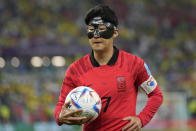 South Korea's Son Heung-min walks with the ball during the World Cup round of 16 soccer match between Brazil and South Korea, at the Education City Stadium in Al Rayyan, Qatar, Monday, Dec. 5, 2022. (AP Photo/Andre Penner)