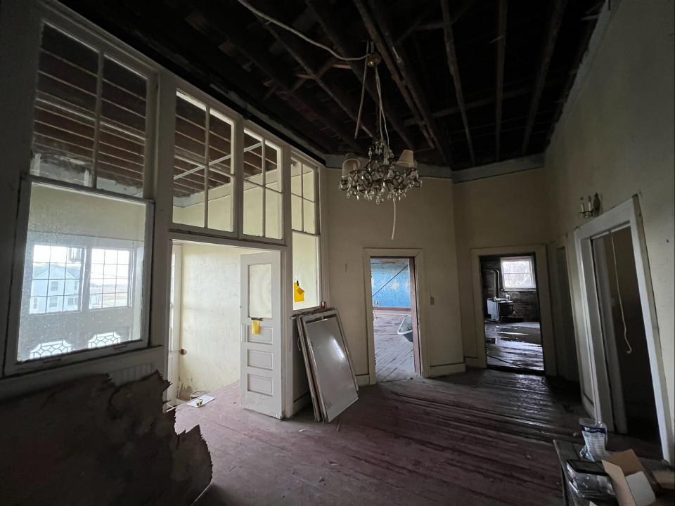 Inside the schoolhouse a chandelier hangs.