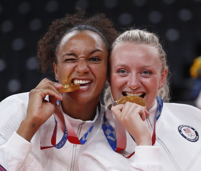 TOKYO, - AUGUST 08: Gr.Am1019$ Jordan Thompson on left and Jordyn Poulter clown around with their gold medals. U.S. vs Brazil gold medal women's volleyball game. This is during the Tokyo Olympics.Tokyo Olympics on Sunday, Aug. 8, 2021 in Tokyo, {stmens}. (Gary Ambrose / For the Times)