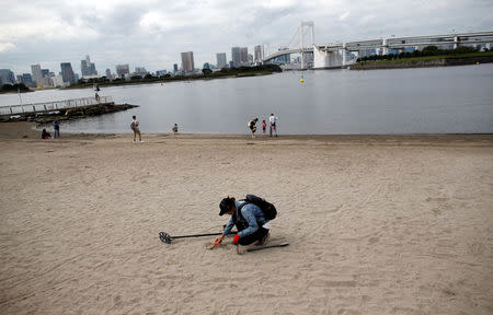 Visitors stroll at Odaiba Marine Park, the venue for Marathon Swimming and Triathlon events during the Tokyo 2020 Games, in Tokyo, Japan October 4, 2017. REUTERS/Issei Kato