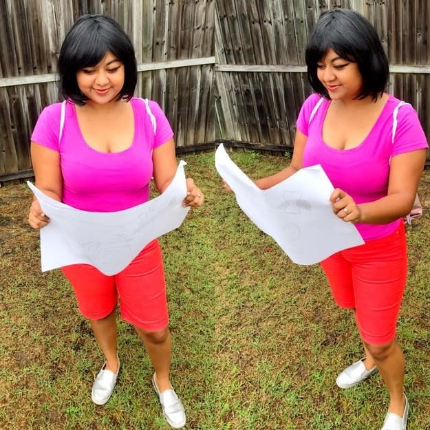 girl in a pink shirt with a map