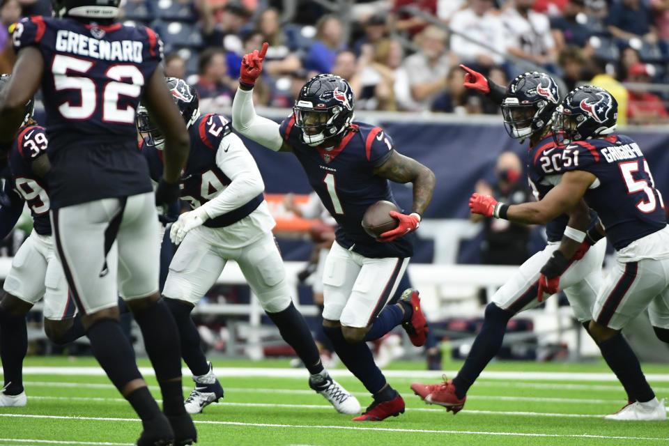 Houston Texans cornerback Lonnie Johnson Jr. (1) celebrates after intercepting a pass against the New England Patriots during the second half of an NFL football game Sunday, Oct. 10, 2021, in Houston. (AP Photo/Justin Rex)