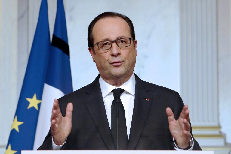 French President Francois Hollande gestures as he addresses the nation during a televised speech at the Elysee Palace in Paris on January 9, 2015