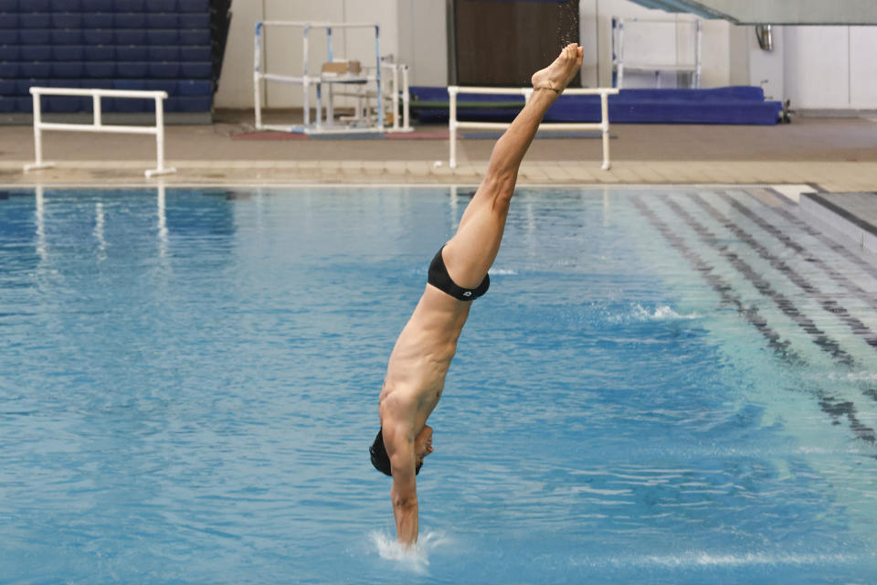 Diego Balleza, a 10-meter Olympic diver, trains in Monterrey, Mexico, Tuesday, June 13, 2023. Because of a lack of financial resources ahead of next year's Paris Olympics, Balleza, who was fourth in synchronized diving on the 10-meter platform at the Tokyo Olympics, chose to join OnlyFans, a site where content creators upload images and videos, some of them explicit. (AP Photo/Jorge Mendoza)