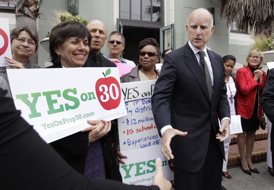 Calif. Gov. Jerry Brown campaigns supporting Proposition 30 at James Lick Middle School in San Francisco, Wednesday, Aug. 22, 2012. As Brown kicked off his campaign for Proposition 30 last week, he sought to emphasize that most of the revenue from the tax increases would come from Californians who are among the wealthiest; an extra $4,500 a year for millionaires, he said. (AP Photo/Paul Sakuma)