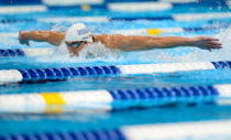 Michael Phelps competes in the championship final of the Men's 100 m Butterfly during Day Six of the 2012 U.S. Olympic Swimming Team Trials at CenturyLink Center on July 1, 2012 in Omaha, Nebraska. (Photo by Jamie Squire/Getty Images)