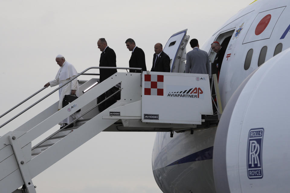 Pope Francis boards off the airplane at the end of his apostolic trip to Thailand and Japan, upon his arrival at Rome's Fiumicino International airport, Tuesday, NOc. 26, 2019. (AP Photo/Gregorio Borgia)