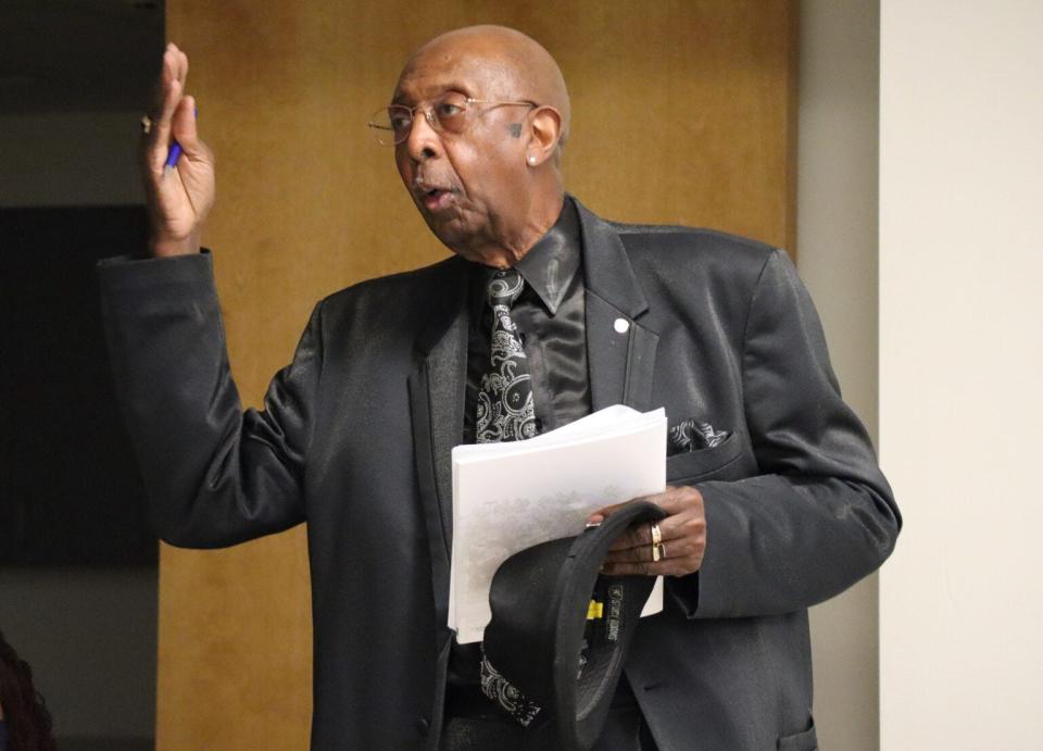 Robert L. Buggs, a leader in the NAACP branch of Gary, Indiana, talks with Environmental Protection Agency officials at an environmental justice workshop Nov. 12 in Gary.