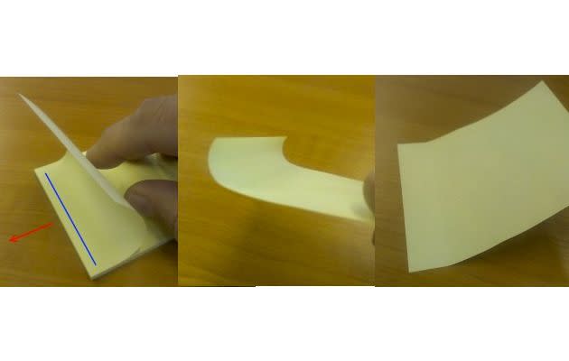 The wrong way to peel a post-it note.