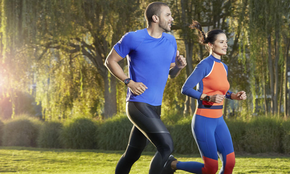 Two joggers wear Amazfit devices.