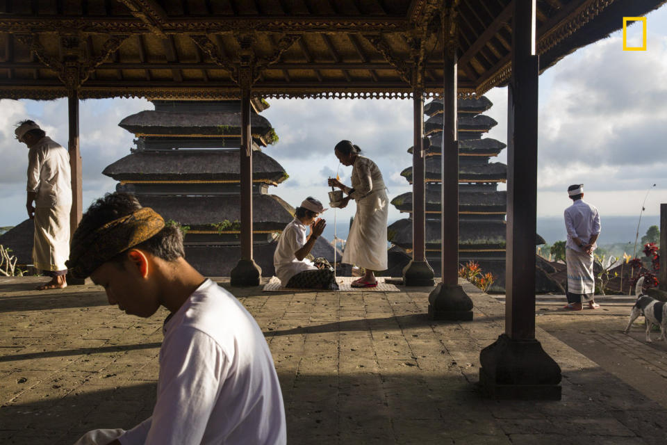 "Besakih Temple has been known as Bali's 'mother temple' for over 1,000 years and is perched 1000 meters&nbsp;high on the southwestern slopes of Mount Agung. Here, Balinese often come to offer up prayer and take blessing from the temple priests, or 'pemangku,' who reside there."&nbsp;― <a href="http://yourshot.nationalgeographic.com/profile/1009407/" target="_blank">Michael Dean Morgan</a>&nbsp;(<a href="http://travel.nationalgeographic.com/photographer-of-the-year-2017/gallery/winners-all/14" target="_blank">Honorable mention, People</a>)