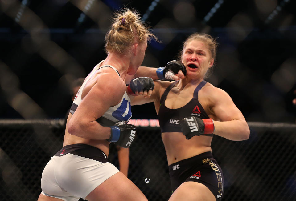 MELBOURNE, AUSTRALIA - NOVEMBER 15:  Ronda Rousey of the United States (R) and Holly Holm of the United States compete in their UFC women's bantamweight championship bout during the UFC 193 event at Etihad Stadium on November 15, 2015 in Melbourne, Australia.  (Photo by Quinn Rooney/Getty Images)