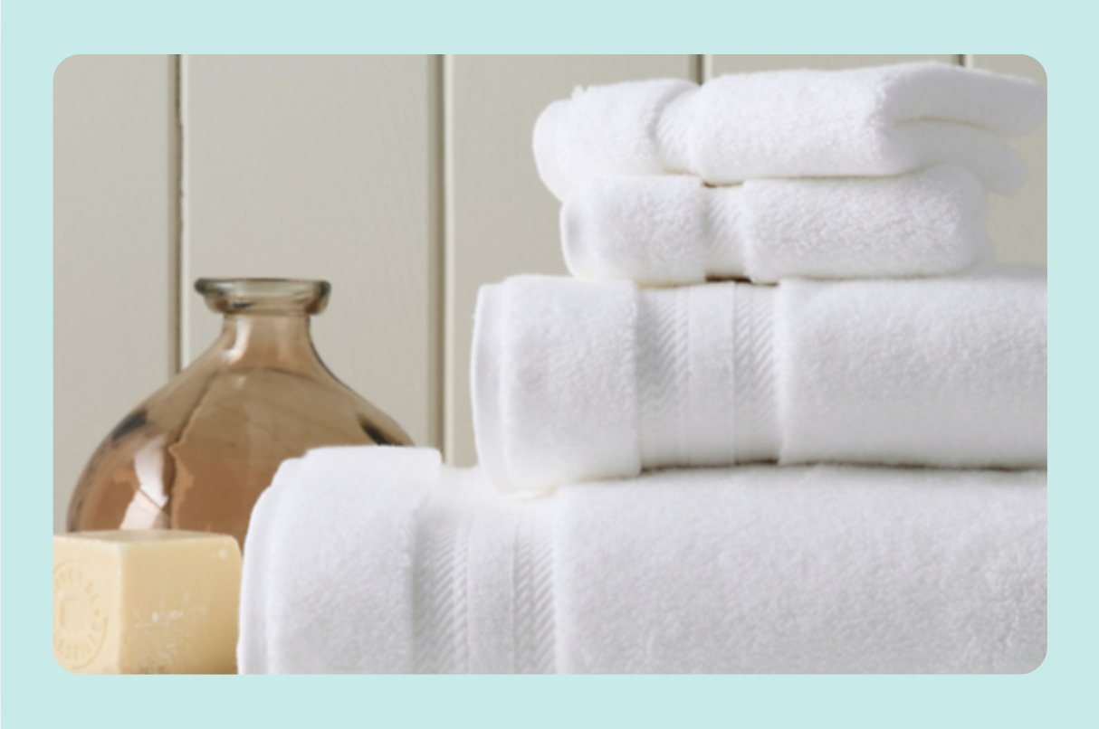 A stack of Garnet Hill Cloud-Loft Towels is shown for Yahoo's Best Plush Bath Towel guide.