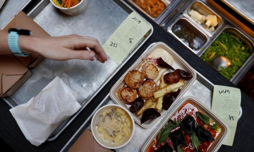 Trays of to-go orders ready to be bagged are seen at the Michelin-star SPQR restaurant.