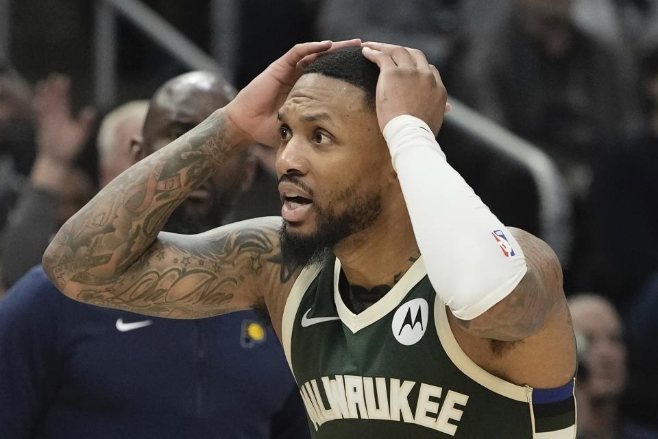 Milwaukee Bucks' Damian Lillard reacts to a call during the first half of Game 2 of the NBA playoff basketball game Tuesday, April 23, 2024, in Milwaukee. (AP Photo/Morry Gash)