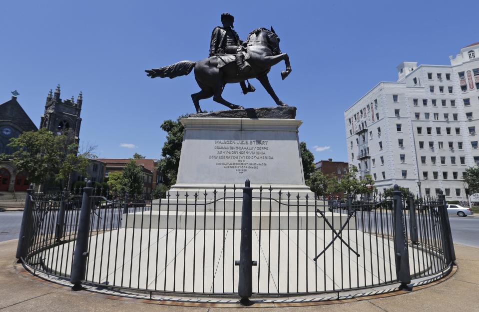 CORRECTS NAME OF STATUE FROM STEWART TO STUART - This June 28, 2017, shows the statue of Confederate Gen. J.E.B. Stuart on Monument Avenue in Richmond, Va. Va. The state with the largest number of Confederate monuments, statues and symbols in the nation, still hasn't come up with a firm plan to respond to years of calls from the black community to remove them. (AP Photo/Steve Helber)