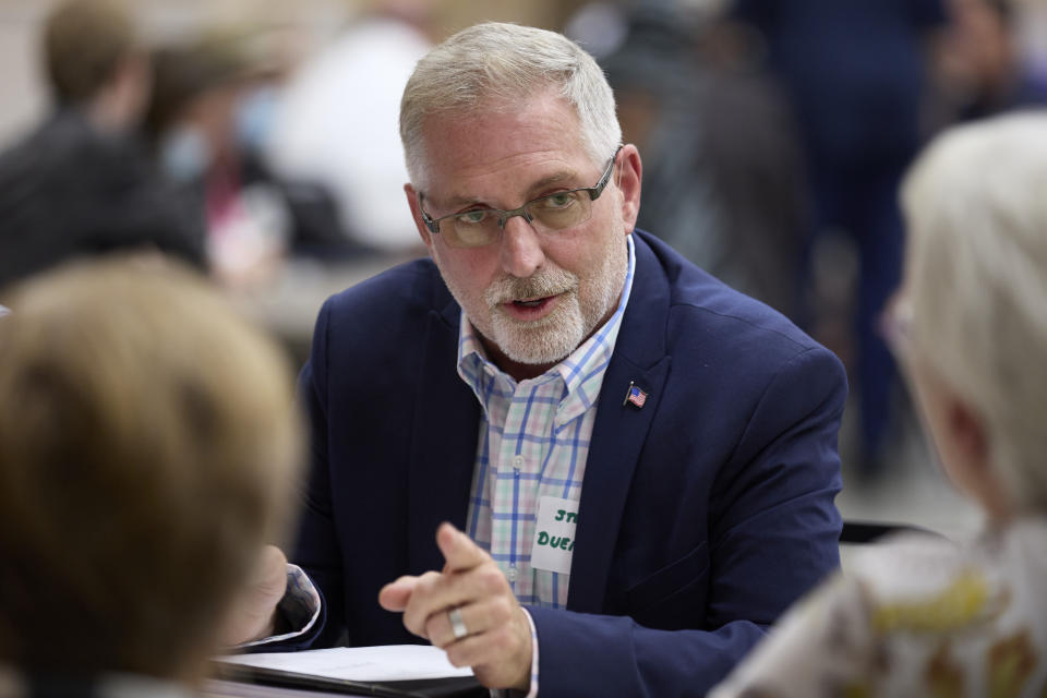 Republican Steve Duenkel, Mason County auditor candidate, talks with voters during before a "candidate speed-dating" style forum, Thursday, Oct. 13, 2022, in Shelton, Wash. Duenkel, a retired Boeing worker is challenging Auditor Paddy McGuire for the office that oversees elections in Mason County. (AP Photo/John Froschauer)