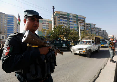 Afghan policemen stand guard at a checkpoint a day before parliamentary elections in Kabul, Afghanistan October 19, 2018. REUTERS/Omar Sobhani