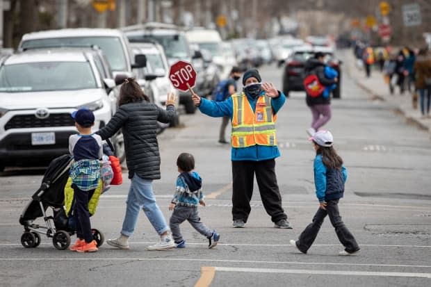 Children leave school on Apr. 6, 2021, after Toronto Public Health ordered all schools in the city to close amidst a surge in COVID-19 cases in Toronto.  (Evan Mitsui/CBC - image credit)