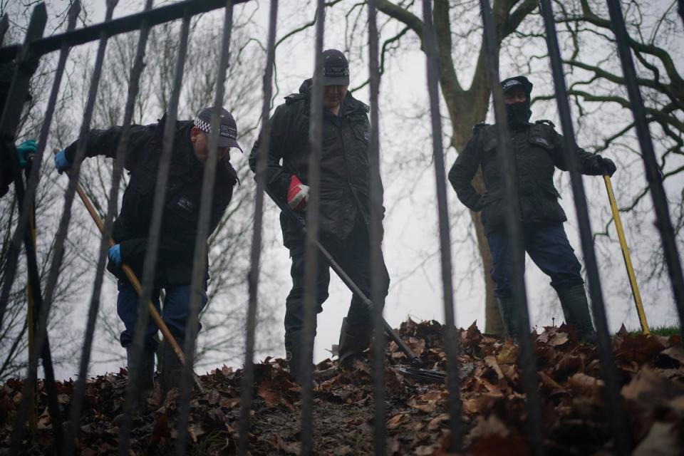 Police officers conduct a search on Primrose Hill in Camden (PA)