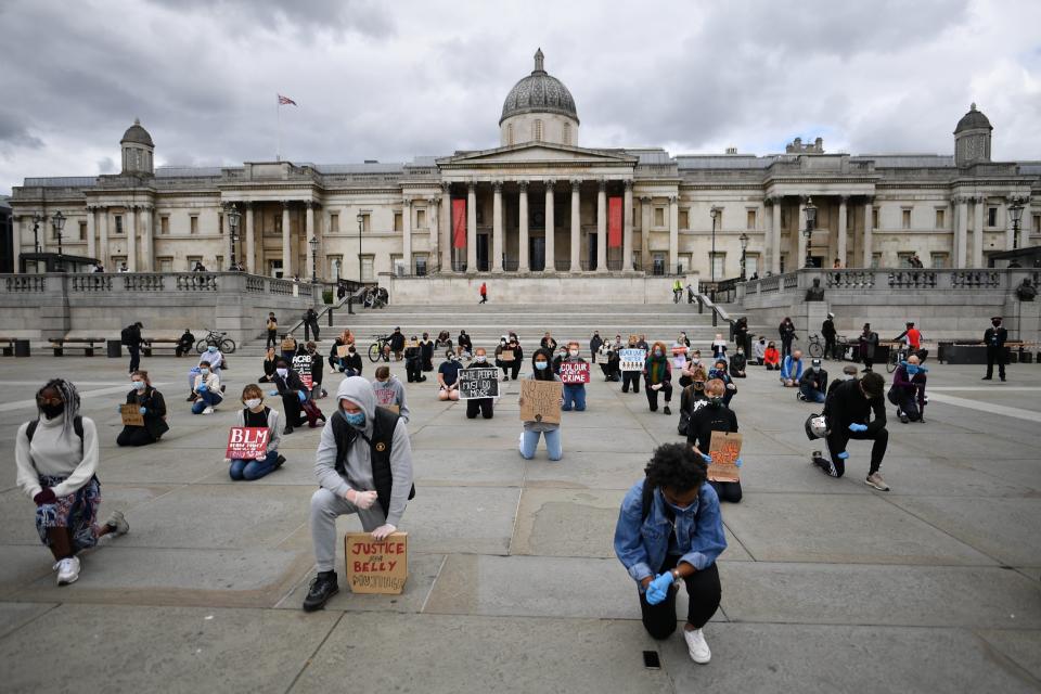 Protesters kneel in Trafalgar Square during a demonstration (Getty Images)