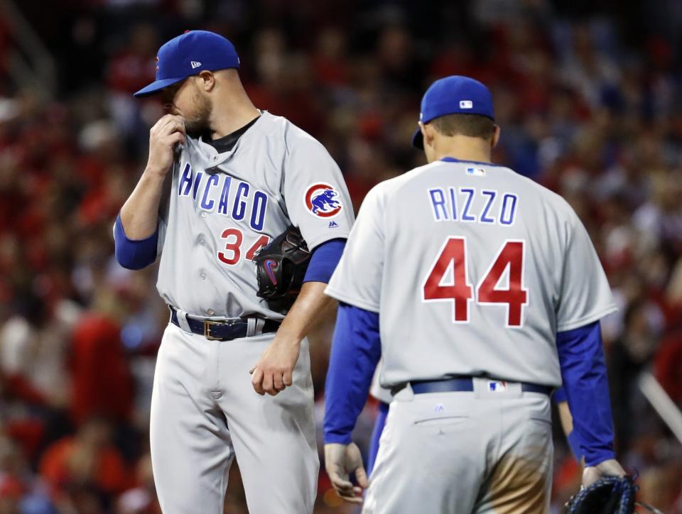 Jon Lester (left) allowed one run on seven hits in five innings against the Cardinals. (AP)