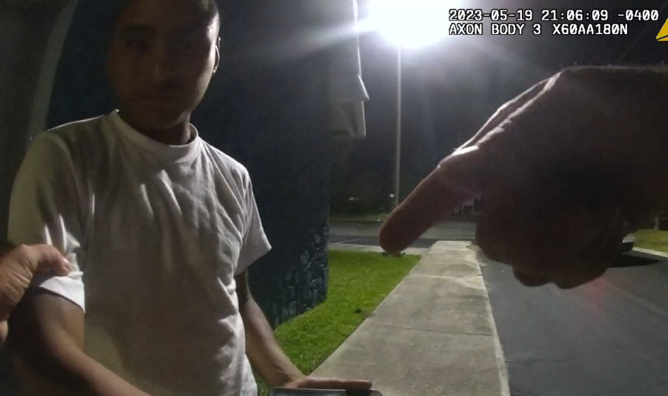 In this body camera image, St. Johns County Sheriff's Office Sgt. Michael Kunovich grabs Virgilio Aguilar Mendez as he begins to attempt to search him on May 19.