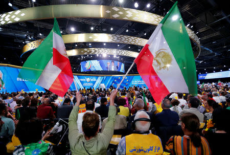 FILE PHOTO: Supporters of Maryam Rajavi, president-elect of the National Council of Resistance of Iran (NCRI), attend a rally in Villepinte, near Paris, France, June 30, 2018. REUTERS/Regis Duvignau/File Photo