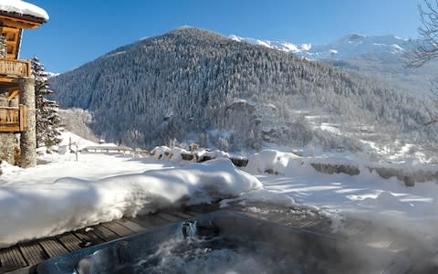 The outdoor hot tub at Chalet Merlo - Credit: Mark Junak