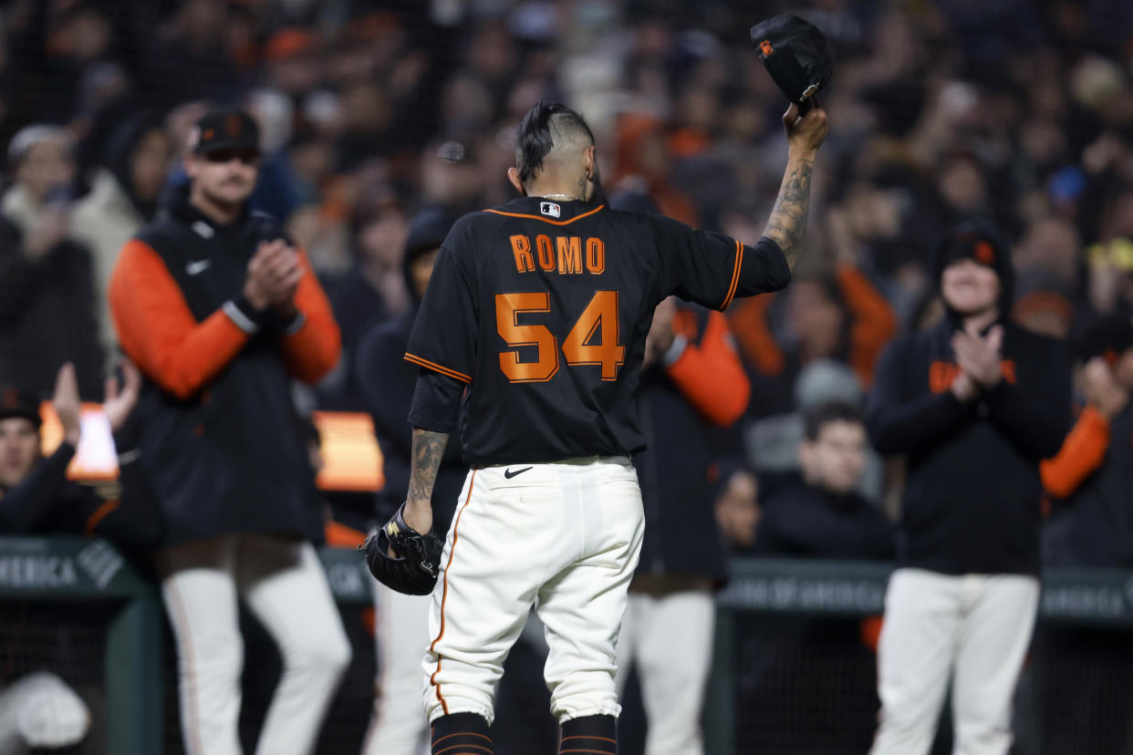 Sergio Romo thanks fans after his final appearance in professional baseball. (AP Photo/Jed Jacobsohn)