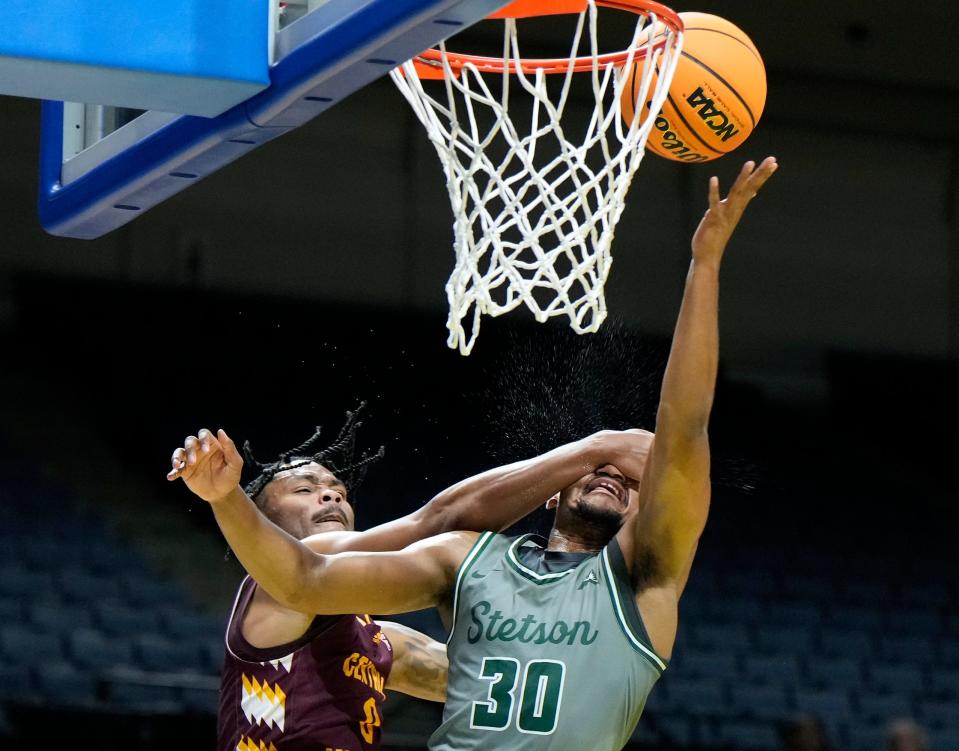 Stetson's Stephan Swenson gets fouled while driving to the basket during a championship game with Central Michigan at the Sunshine Slam Tournament at the Ocean Center in Daytona Beach, Tuesday, Nov. 21, 2023.