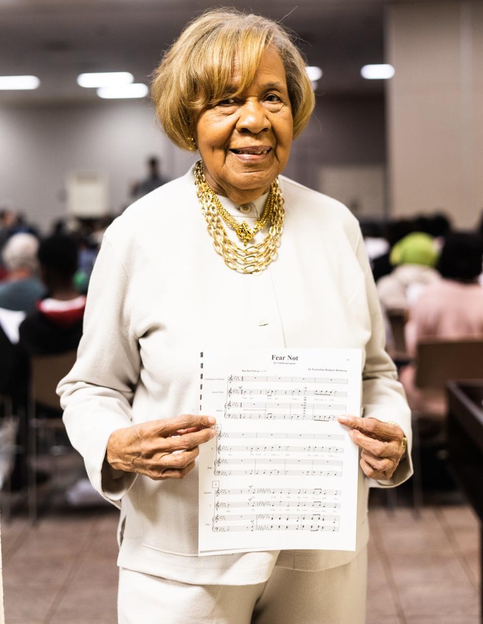 Earnestine Rodgers Robinson, 86, a self-taught Memphis classical music composer, holds up one of her compositions, “Fear Not,” during a rehearsal for her "Harriet Tubman Oratorio" at First Baptist Church on Feb. 5 in Memphis. Her Harriet Tubman piece will have its world premiere in Memphis on Sunday, Feb. 11.