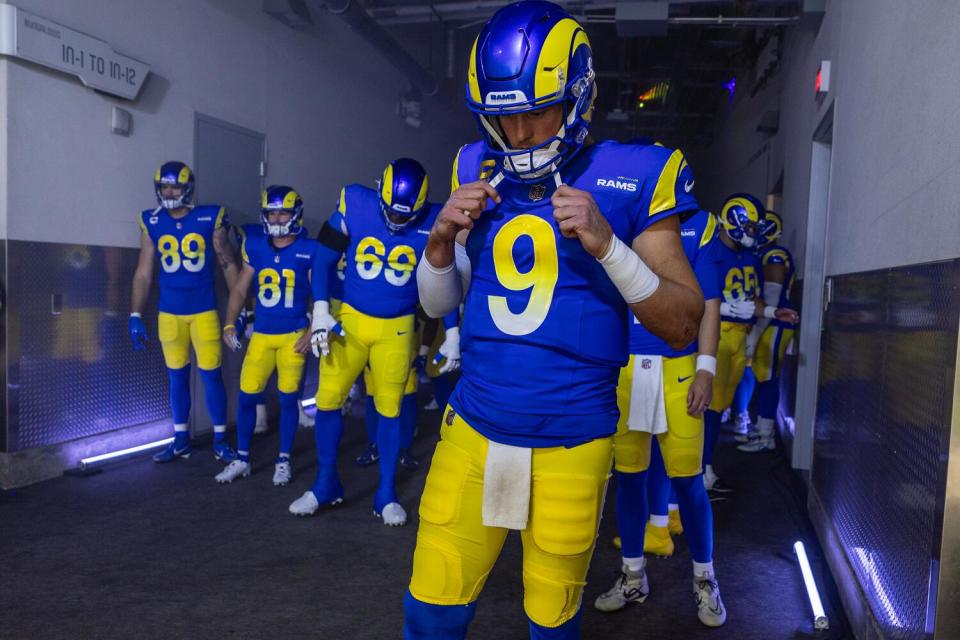 Rams quarterback Matthew Stafford (9) readies to lead the team out the tunnel and onto the field.