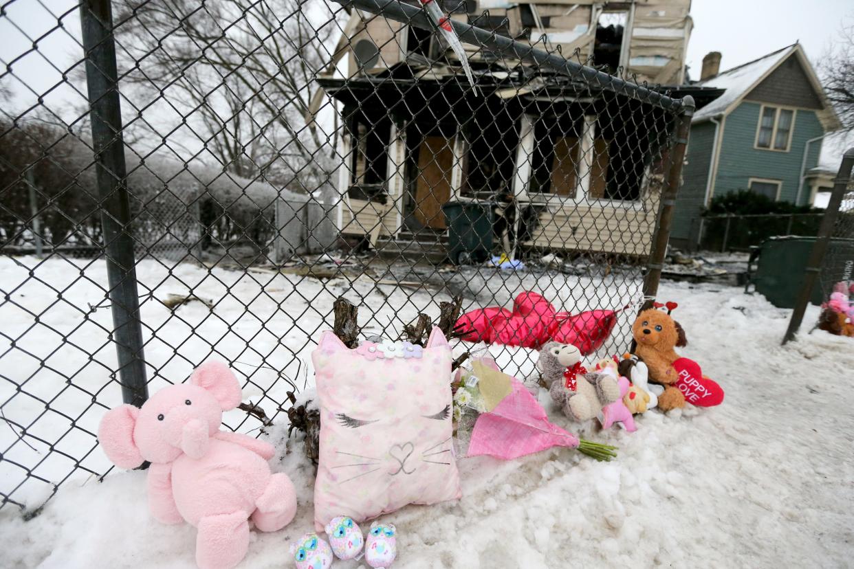 People have created a memorial of stuffed animals, candles and flowers, seen Tuesday, Jan. 23, 2024, at the scene of Sunday’s house fire at 222 N. LaPorte Ave. that killed five children.