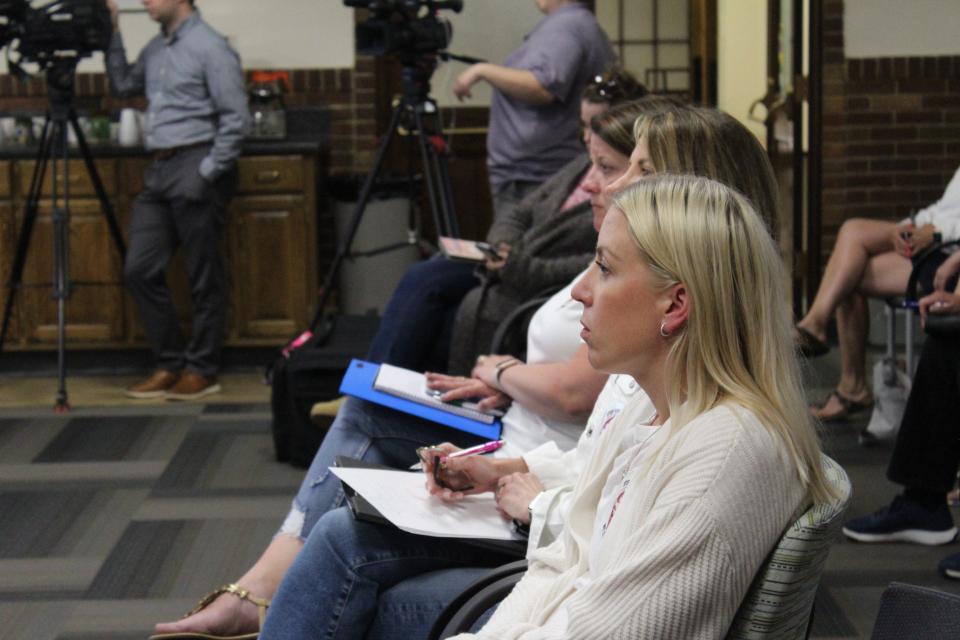 Leah Weakley, a Wequiock Elementary School parent, listens during the Green Bay School Board meeting on school closures Monday in Green Bay. Wequiock is one of the schools recommended to close in the Green Bay School District.