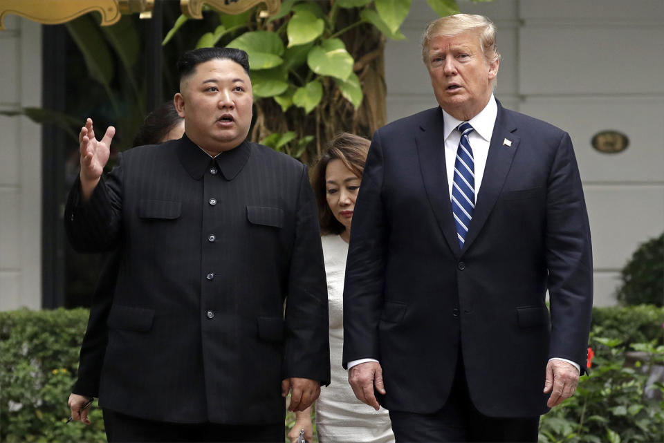 FILE - In this Feb. 28, 2019, file photo, U.S. President Donald Trump, right, and North Korean leader Kim Jong Un take a walk after their first meeting at the Sofitel Legend Metropole Hanoi hotel, in Hanoi, Vietnam. North Korea's relentless barrage of firepower - the latest test came Tuesday morning, Sept. 10, has managed to do what once seemed inconceivable: It has normalized a martial display of defiance that not too long ago raised fears of war in one of the most dangerous corners of the world. The tests, which U.S. President Trump has repeatedly dismissed as routine, are just the latest bit of proof that North Korea, a small, fiercely proud, totalitarian nation surrounded by big powers, is a master at getting a lot from a little.(AP Photo/Evan Vucci, File)