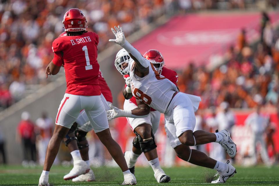 Texas edge rusher Barryn Sorrell pressures Houston quarterback Donovan Smith during their game on Oct. 21. Sorrell, who's back in his hometown of New Orleans to play in the Sugar Bowl, is eligible for the NFL draft but hasn't decided yet whether to return for one more season.