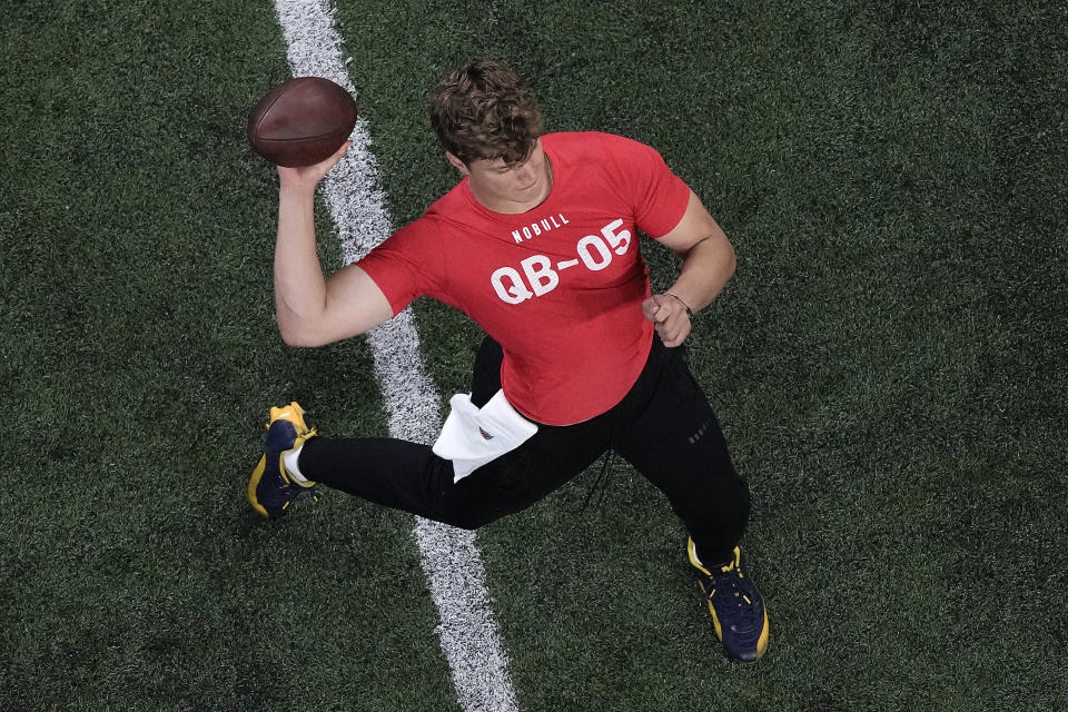 Michigan quarterback JJ McCarthy passes during the NFL football scouting combine, Saturday, March 2, 2024, in Indianapolis.  (AP Photo/Charlie Riedel)