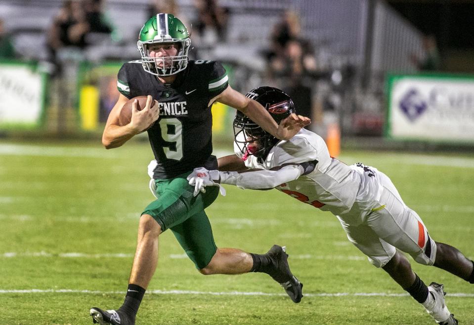 Venice quarterback Brooks Bentley (9) escapes the tackle of Seminole linebacker Jordyn Perkins (11) during their  Friday night matchup in Venice. MATT HOUSTON/HERALD-TRIBUNE